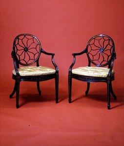 George III ebonised and gilded armchairs in the style of Chippendale, late 18th century by English School