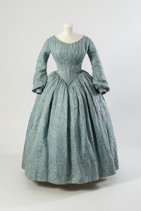 Light blue flowered silk dress with shaped pointed bodice and long full sleeves by English School