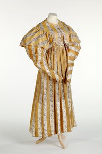Muslin dress with abstract mauve pattern printed within yellow and white vertical stripe design, c.1820-30