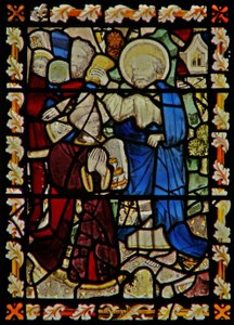 The east window depicting St Peter baptising a young man