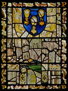 The east window depicting a shield with emblems of the Sacrament; fragments of canopy with figures
