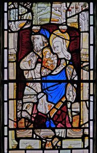 Window Ew depicting St Anne, Joachim, the Virgin Mary and the Christ Child by English School