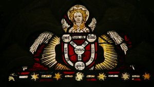 Window depicting an angel with a Trinity shield