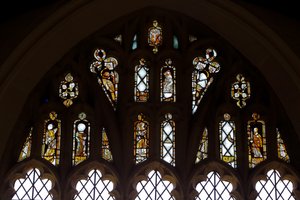 Window depicting the Tracery Lights with God, the Trinity, St Peter, St Paul, St Catherine and Gabriel, and a Bird by English School