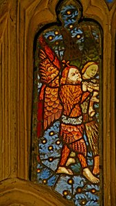 Window depicting musician angels with pibcorns by English School