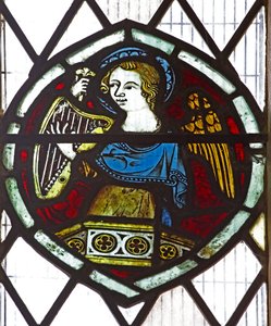 Window n6 depicting an angel with a harp by English School