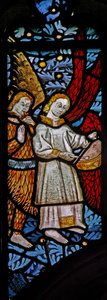 Window depicting musician angels with pipe and tabor by English School