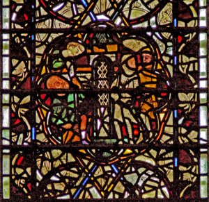 Window W60 depicting St Paul is lowered in a basket by English School