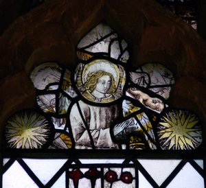 Window w6 depicting an angel and Edward IV sun-bursts by English School