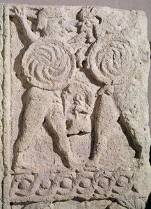 Detail of a tombstone with two warriors