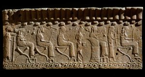 Etruscan civilization: terracotta frieze adorned with low reliefs of divinities and seated dignitaries. 580 BC Dim. 24x54 cm. From Murlo Palace. Murlo, Antiquarium Comunale by Etruscan