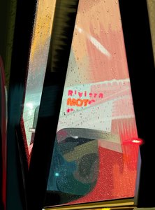 Rivera Motel Sign Seen from Car on Rainy Night by Evan Sklar