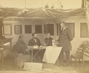 Chinese Interpreters with Secretary Drew and Minister Low in Cabin of the U.S. Flag Ship Colorado by Felice Beato