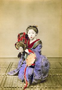 Geisha playing the tsuzumi, Japan