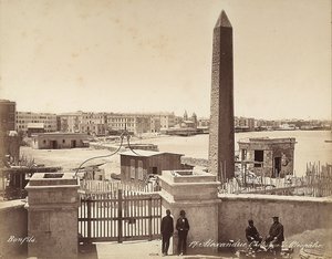 Alexandria, Egypt: the Obelisk of Cleopatra, with four men posing for the photograph by Félix Bonfils