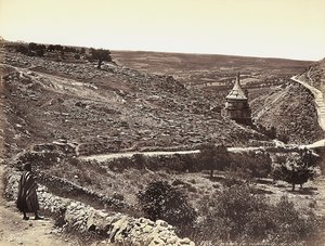 Panoramic view of the Valley of Cedron or Josafat, with the Tomb of Absalom, on the outskirts of Jerusalem. A man is looking at the view from the street by Félix Bonfils