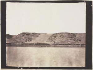 General View of Monuments Carved into Bedrock with Photographers Dahabieh. Abu Simbel by Félix Teynard