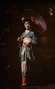 Japanese woman holding parasol and wearing kimono, early color autochrome, circa 1916