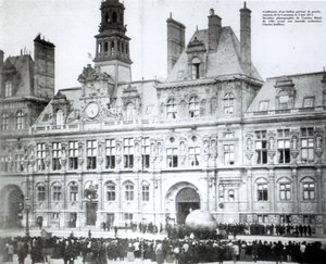 Inflating a balloon with the declarations of the Commune attached to it outside the Hotel de Ville, Paris