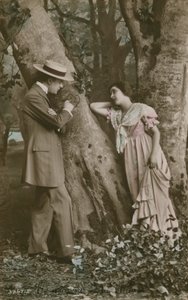 Postcard of lovers carving a heart on a tree, sent in 1913 by French Photographer