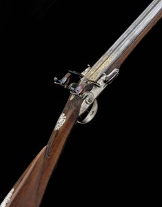 A Fine and Rare 20-Bore Silver-Mounted French D.B. Flintlock Sporting Gun by French School
