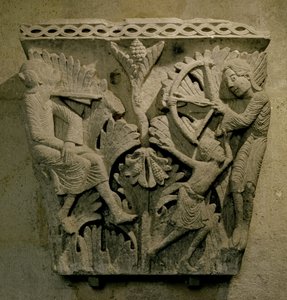 Capital Depicting a Man Shooting an Arrow into the Neck of Another
