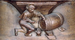 Carving depicting a man putting a tap on a barrel, from a choir stall from the Abbey of St. Lucien in Beauvais