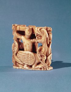 Chess piece in the form of a knight fighting a dragon