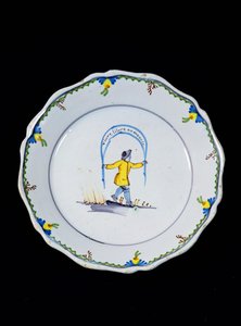 Plate Decorated with a Person Holding a 