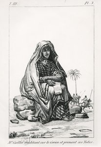 Rene Caille pondering over the Koran and taking notes, from Journal d