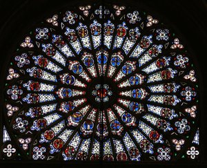 Rose window depicting Christ surrounded by the twelve Apostles and Evangelist symbols by French School