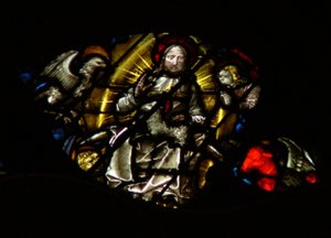 The west rose window depicting a scene from the Book of Revelation: Lamb before the throne, between the four sacred living creatures by French School