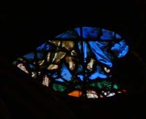 The west rose window depicting a scene from the Book of Revelation: Resurrection of the witnesses and their ascension whilst the lookers on are amazed by French School