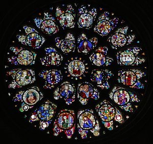 The west rose window with fragmentary fifteenth and sixteenth panels mostly depicting saints by French School