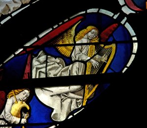 Window depicting musician angels with harp and bagpipe
