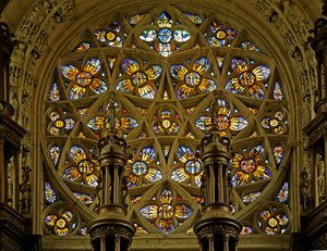 Window depicting the Rose Window, flaming Suns