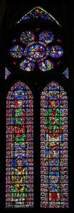 Window w102 depicting St Peter and St Andrew; Soissons Cathedral and a Bishop; in the rose Scenes from the life of St Peter
