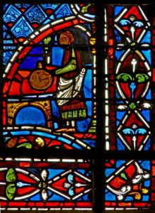 Window w11 depicting a draper donor and border panels by French School