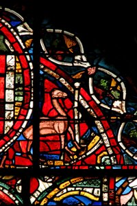 Window depicting a scene from the Prodigal Son story: a camel stands by to help him remove his inheritance by French School