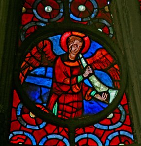 Window w141 depicting a musician angel with a shawm by French School
