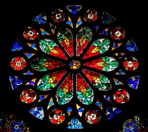 Window w17 depicting a rose with naturalistic design by French School