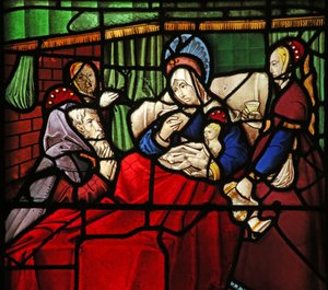 Window depicting the Life of St Remi. The saint-hermit Montan is miraculously healed by the milk applied by the saint to his eyes