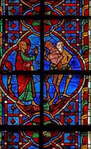 Window depicting Adam and Eve admonished for eating fruit by French School