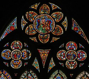 Window w207 depicting the tracery lights with two angels and the Virgin and Child