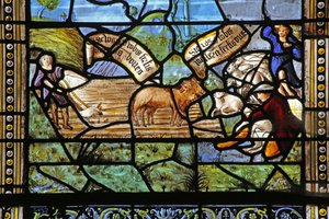 Window depicting Virgil-inspired country scenes beneath Christ on Cross