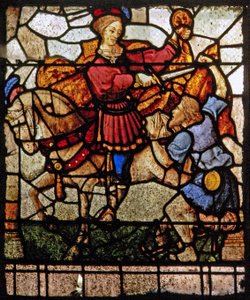 Window depicting the Charity of St Martin: he divides his cloak