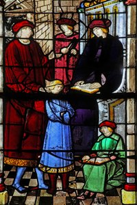 Window depicting the life of St Augustine: he is taken to school by his father