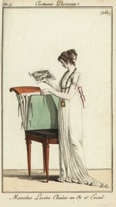 Woman looking at a portfolio of engravings