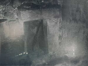 Inside Door of Igloo by Light of Blubber Lamps