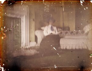 Woman sitting on a Sofa